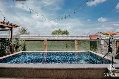 a swimming pool in the middle of a backyard at Ipoh 27 Private Pool Villa By Verve EECH118 in Ipoh
