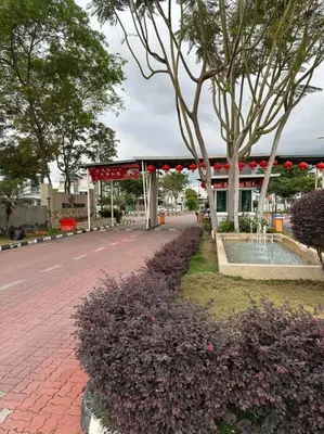 a building with a pavilion in the middle of a street at Ulike~home stay~Setia residen~4room in Kampong Selamat