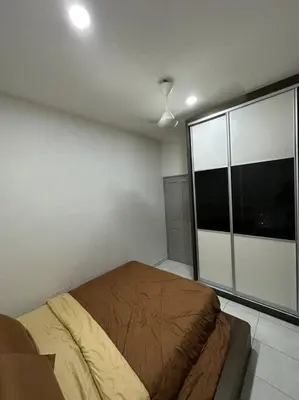 a bedroom with a bed and a large window at Ulike~home stay~Setia residen~4room in Kampong Selamat