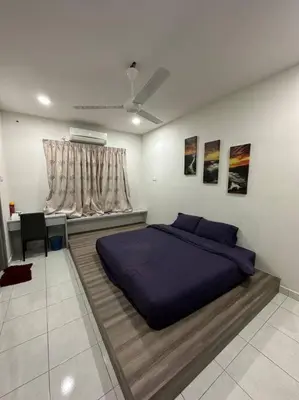 a bedroom with a bed and a desk and a window at Ulike~home stay~Setia residen~4room in Kampong Selamat