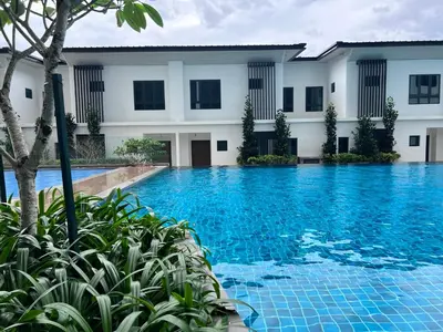 a swimming pool in front of a building at Ojies Onsen - 3 guest only in Ipoh