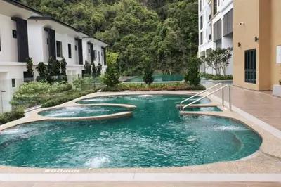 a swimming pool in the middle of a building at Ojies Onsen - 3 guest only in Ipoh
