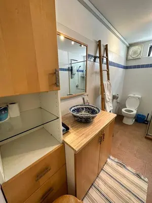 a bathroom with a sink and a toilet at Popus Heritage Townhouse, Georgetown in George Town