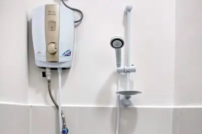 a soap dispenser on a wall in a bathroom at Cameron Hill Homestay in Tanah Rata