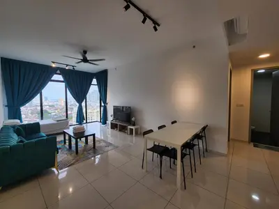 a living room with a table and a couch at Beacon Executive Suites - Penang in George Town