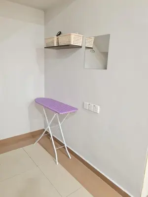 a purple chair in a room with a wall at Air-home M9 Simpang near Aulong Econsave, 4BR, 10pax, Netflix in Taiping