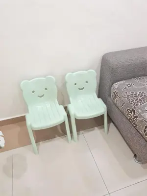 two white chairs sitting next to a bed at Air-home M9 Simpang near Aulong Econsave, 4BR, 10pax, Netflix in Taiping