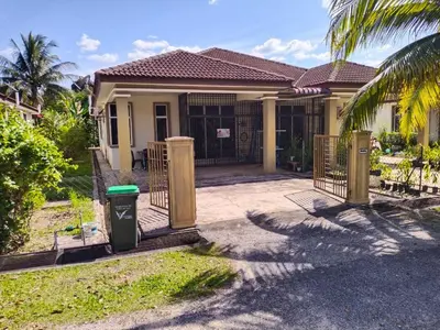 a house with a trash can in front of it at Permai Homestay in Baling