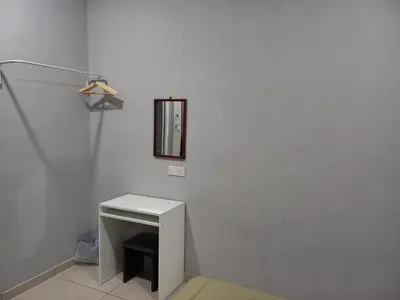 a bathroom with a white sink and a mirror at Yaths homestay in Butterworth