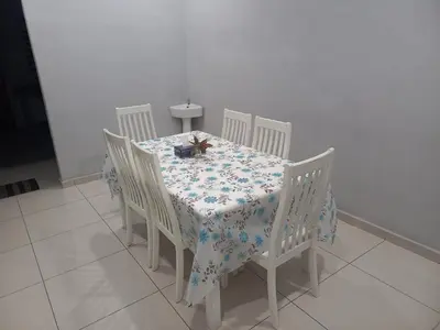 a dining room table with a blue and white table cloth at Yaths homestay in Butterworth