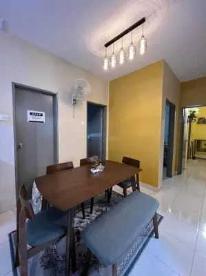 a dining room with a wooden table and chairs at My Chillex Homestay#Muslim Guest Only#3R 2B Apartment in Penang# in George Town