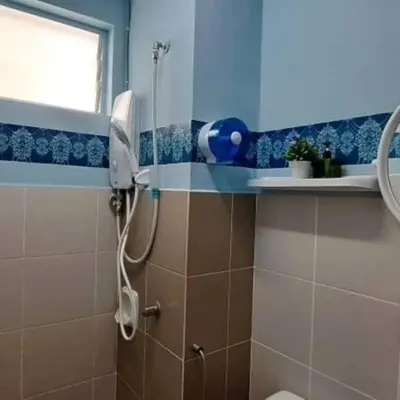 a bathroom with a shower with a blow dryer at My Chillex Homestay#Muslim Guest Only#3R 2B Apartment in Penang# in George Town