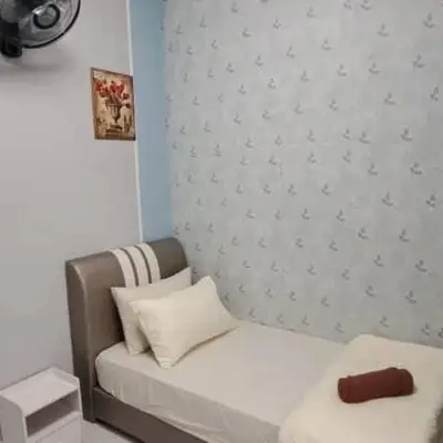 a small bedroom with a couch and a wall at My Chillex Homestay#Muslim Guest Only#3R 2B Apartment in Penang# in George Town
