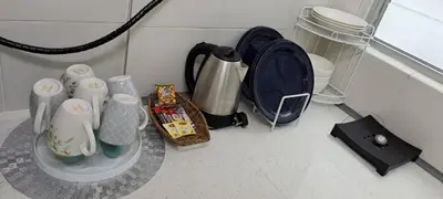a counter top with a coffee pot and other items at My Chillex Homestay#Muslim Guest Only#3R 2B Apartment in Penang# in George Town