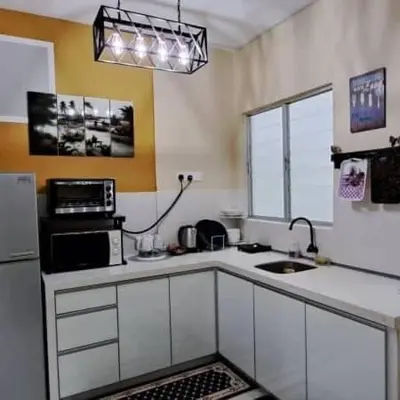a kitchen with a sink and a microwave at My Chillex Homestay#Muslim Guest Only#3R 2B Apartment in Penang# in George Town
