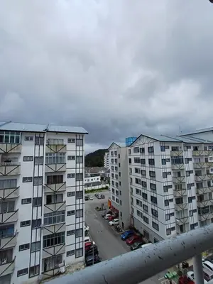 a view of two tall buildings and a parking lot at Amrich Staycation Muslim Cameron Highlands in Tanah Rata