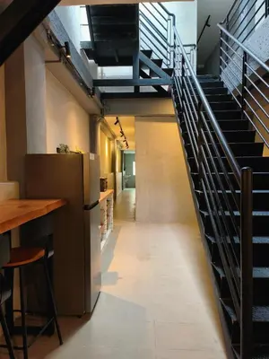 a staircase in a building with a bar and a counter at Armenian Guest House by LOLZ for 22pax in George Town