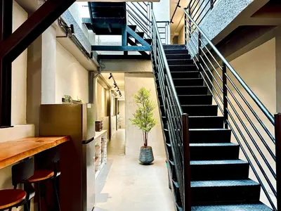 a staircase in a building with a potted plant at Armenian Guest House by LOLZ for 22pax in George Town