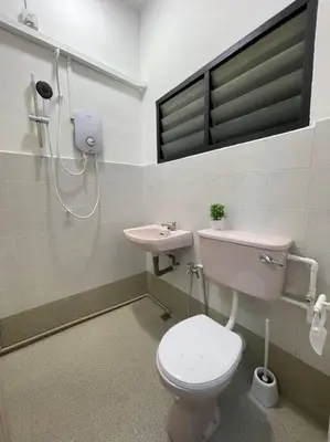 a bathroom with a toilet and a sink at Ipoh 42 Symphony 12pax 4Bedroom 3bathroom 3carpark in Ipoh
