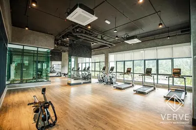 a gym with a bunch of treadmills and exercise bikes at Ipoh Tambun Lost World Onsen by Verve in Tambun