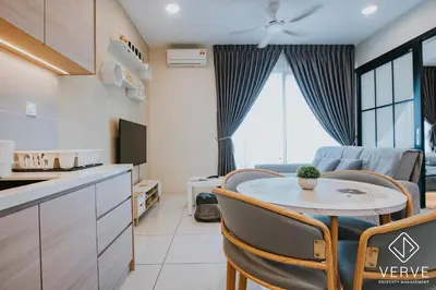 a kitchen and a living room with a table and chairs at Ipoh Tambun Lost World Onsen by Verve in Tambun