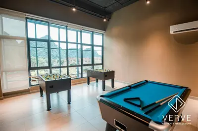 a pool table in a room with a view at Ipoh Tambun Lost World Onsen by Verve in Tambun