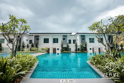 a swimming pool in front of a building at Ipoh Tambun Lost World Onsen by Verve in Tambun