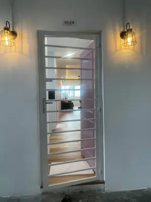 a door leading into a room with a hallway at Cameron Homestay Adik Aisyah Purple Romance for Islam in Tanah Rata