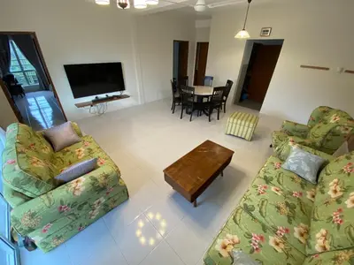 a living room with two couches and a table at Jo’s Place Cameron Highlands EA922 in Brinchang
