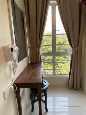 a desk in a room with a large window at Jo’s Place Cameron Highlands EA922 in Brinchang