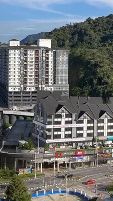 a large building with a black roof in a city at Jo’s Place Cameron Highlands EA922 in Brinchang