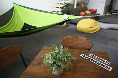 a table with a green tent in a room at Private 100 inches Screen Cinema at CEO Penang in Bayan Lepas