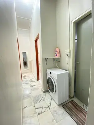 a laundry room with a washing machine in it at Nur Kasih Homestay Seri Manjung in Seri Manjung