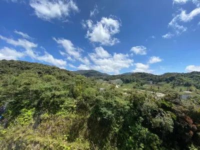 a view of a hill with trees and a blue sky at Aufa Homestay at Emerald Avenue Brinchang in Brinchang