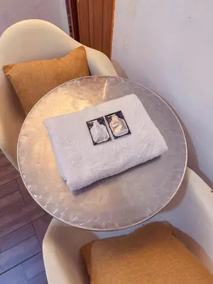 a glass table with a napkin on top of it at Tonight Hotel in George Town