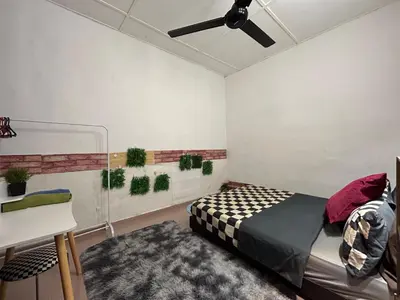 a bedroom with a bed and a ceiling fan at Cozy255#4pax#Wifi#NearAeonAlma#5kmtoIconCity in Bukit Mertajam