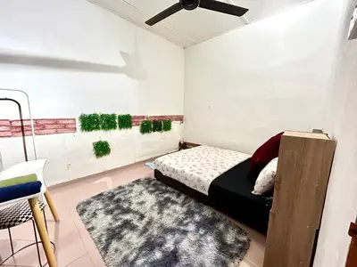 a small bedroom with a bed and a rug at Cozy255#4pax#Wifi#NearAeonAlma#5kmtoIconCity in Bukit Mertajam