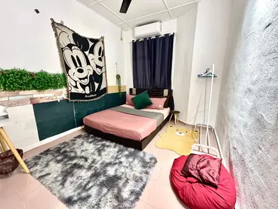 a living room with a bed and a couch at Cozy255#4pax#Wifi#NearAeonAlma#5kmtoIconCity in Bukit Mertajam
