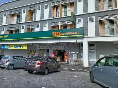 a group of cars parked in front of a building at Studio House Kampar in Kampar