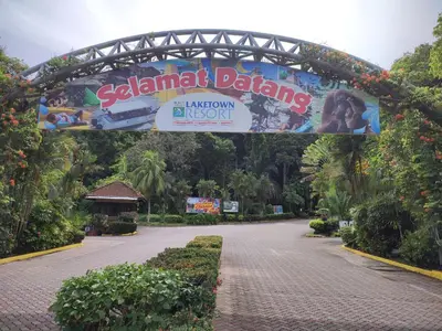 a sign for a disneylandland dancing sign in a park at Sofea Inn Bukit Merah - Suria A7727 in Kampong Selemat