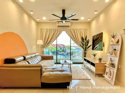 a living room with a couch and a ceiling fan at Manhattan Condo Ipoh Waterpark PoolView FREE Carpark & Netflix by PLY Home in Ipoh
