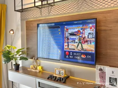 a flat screen tv hanging on a wall at Manhattan Condo Ipoh Waterpark PoolView FREE Carpark & Netflix by PLY Home in Ipoh