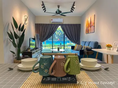 a living room with a couch and a table at Manhattan Condo Ipoh Waterpark PoolView FREE Carpark & Netflix by PLY Home in Ipoh