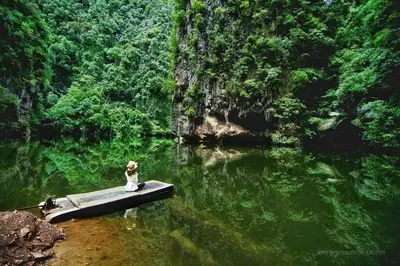 a dog sitting on a raft in the water at Bdr Seri Botani ipoh-nordic (tvbox/mahjong 19pax) in Ipoh