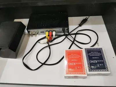 a table with a laptop computer and two batteries at Bdr Seri Botani ipoh-nordic (tvbox/mahjong 19pax) in Ipoh