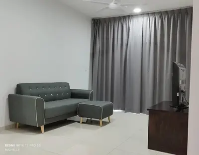 a living room with a couch and a chair at Spaces 3bed Room New Condo @ Kg Paloh Ipoh in Ipoh