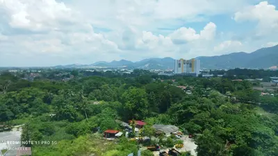 an overhead view of a city with mountains and trees at Spaces 3bed Room New Condo @ Kg Paloh Ipoh in Ipoh