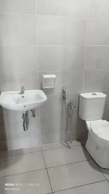 a bathroom with a sink and a toilet at Spaces 3bed Room New Condo @ Kg Paloh Ipoh in Ipoh
