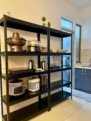 a black book shelf filled with pots and pans at Paddy Bee in Brinchang