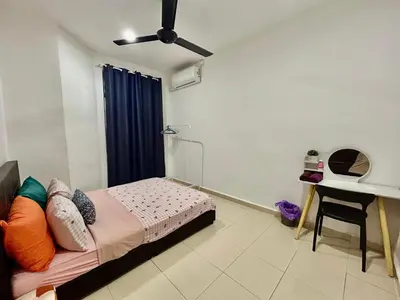 a bedroom with a bed and a desk in it at Cozy288#4pax#wifi#NearAeonAlma,Mcd#2kmtoIconicPoint in Bukit Mertajam